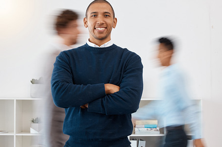 Happy businessman portrait, motion blur and busy office in corporate accounting audit company. Portrait smile of financial manager, employee and management leader with vision, pride and arms crossed, a Photo by Peopleimages.com
