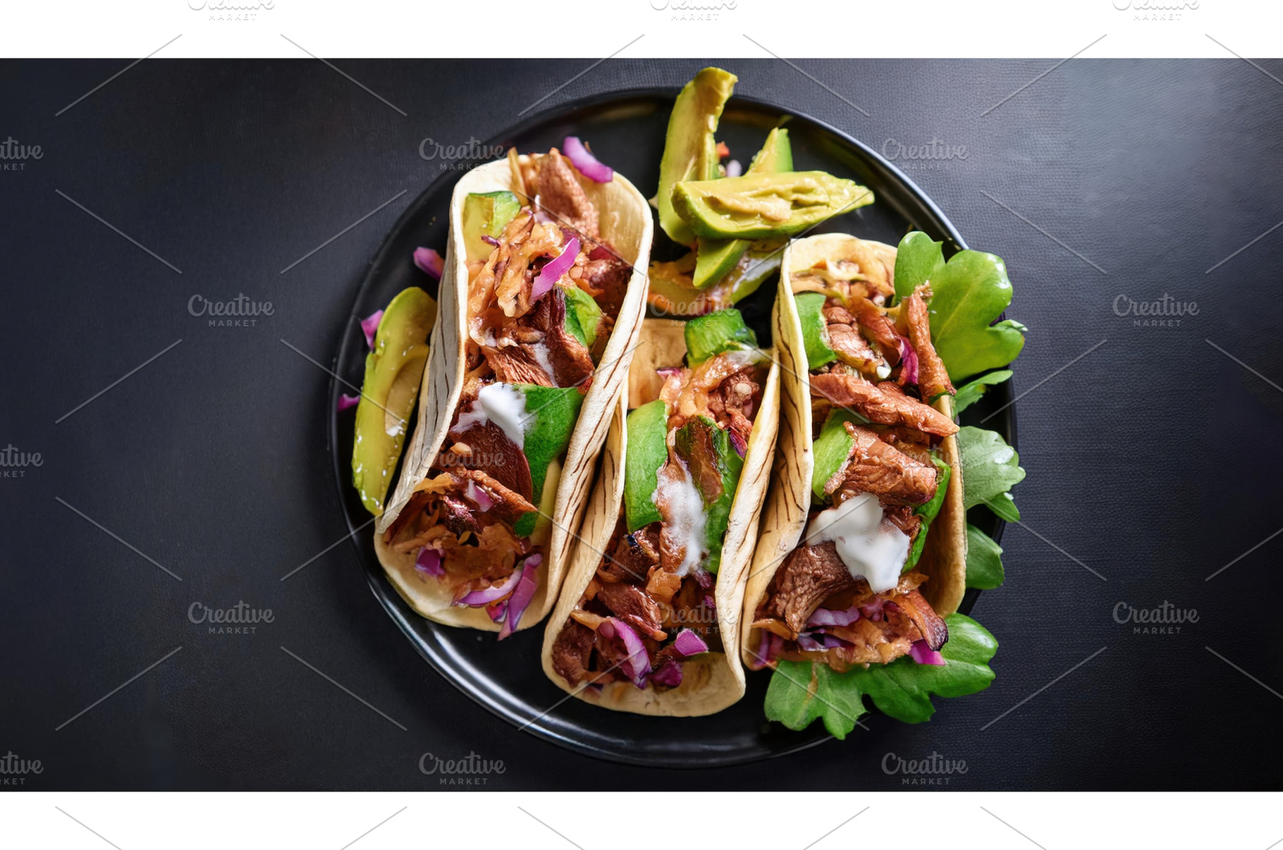 Three tacos filled with seasoned, a Food & Drink Photo by Igor Tichonow