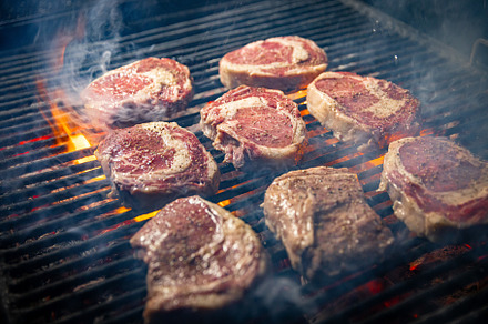 Steaks are in various stages of cooking, a Photo by Grafvision photography
