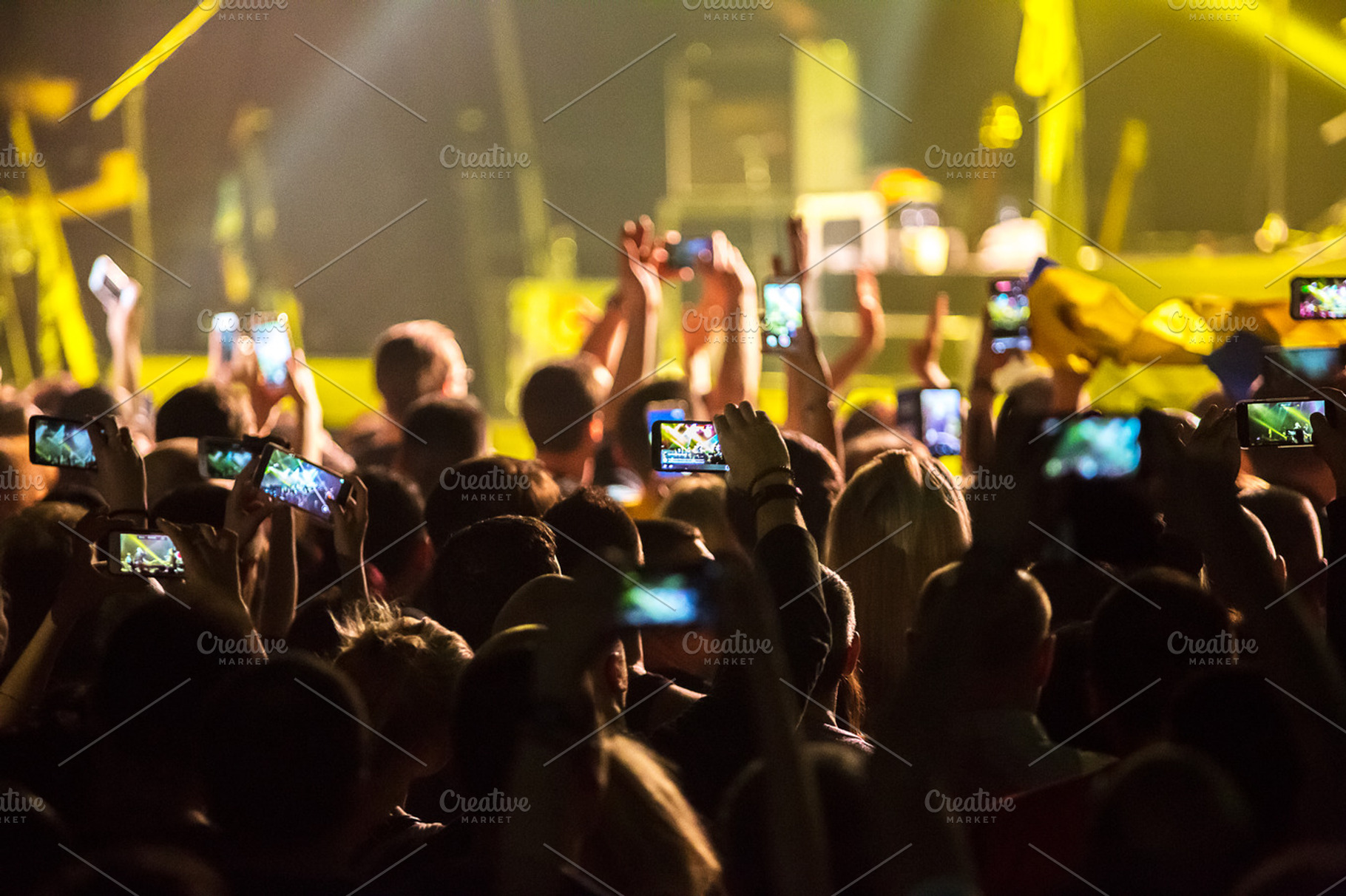 Crowd at concert and blurred stage lights  featuring crowd, people, and event, a Person Photo by suprunvitaly