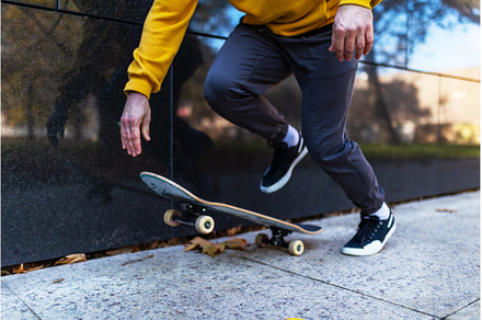 Close up on legs and skateboard of, a Sports & Recreation Photo by HalfPoint