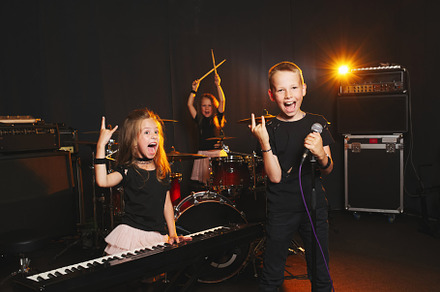 Children singing and playing music containing band, playing, and music