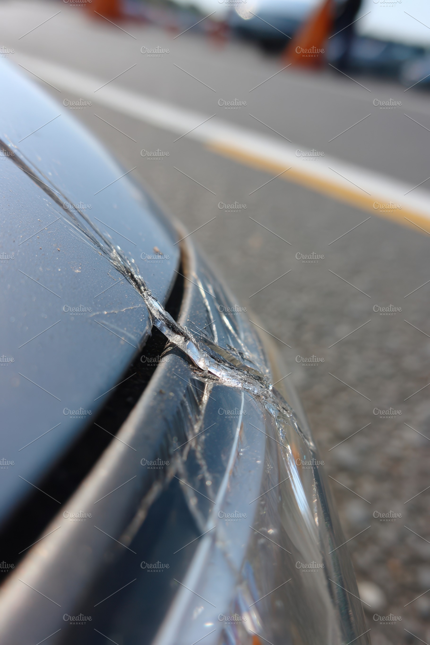 Close-up of a cracked car bumper, a Transportation Photo by AlyaAnd