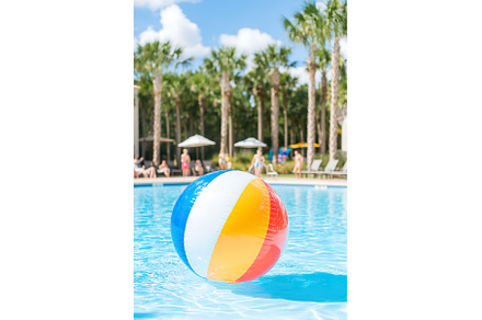 Colorful beach ball floating in, a Holiday Photo by Lermont51
