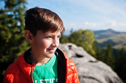 Boy on top of mountain. Children hiking on beautiful day in moun, a Nature Photo by AS photostudio