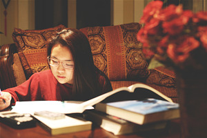Studying on coffee table containing student, studying, and books