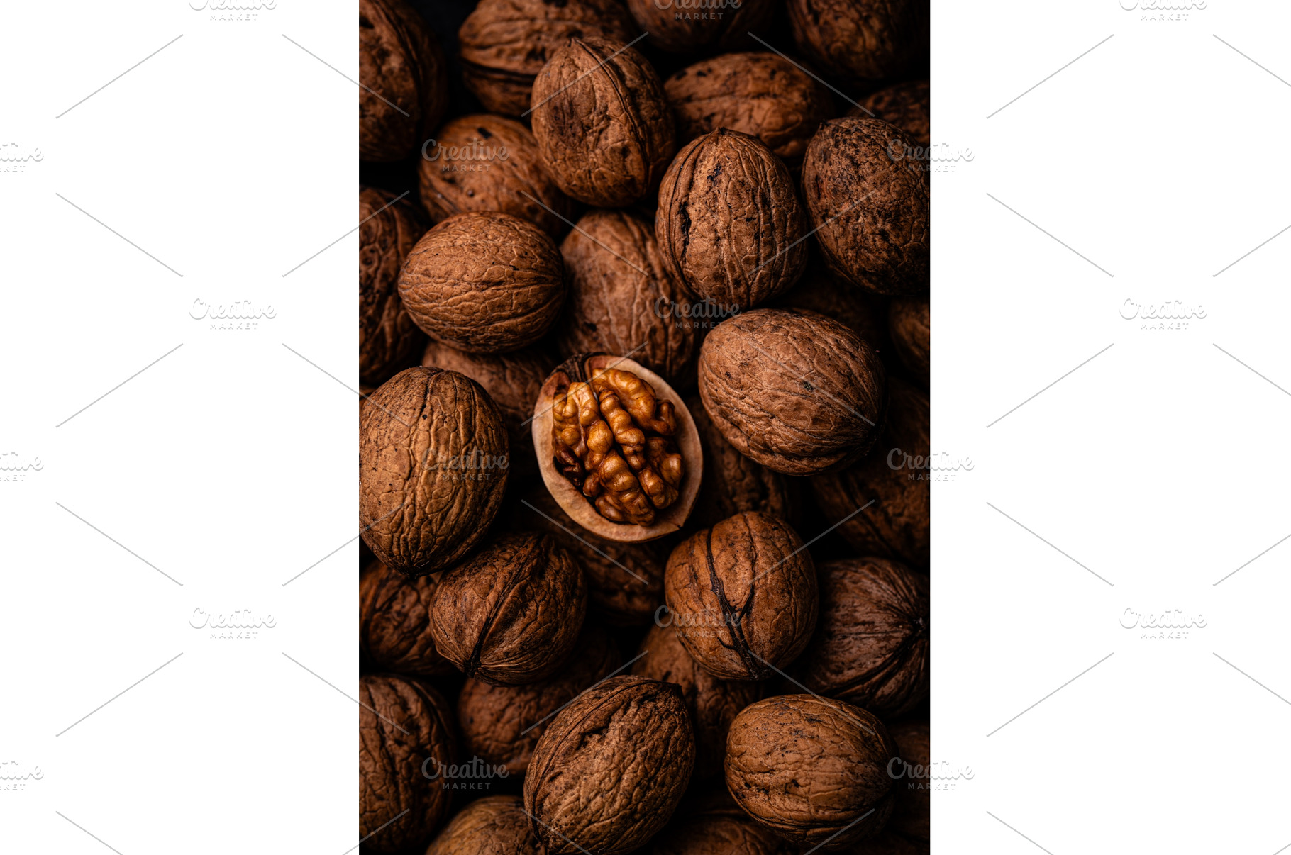 Pile of walnuts with one opened, a Food & Drink Photo by Yulia Furman