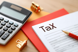 Tax preparation tools on a desk, a Business Photo by AlyaAnd