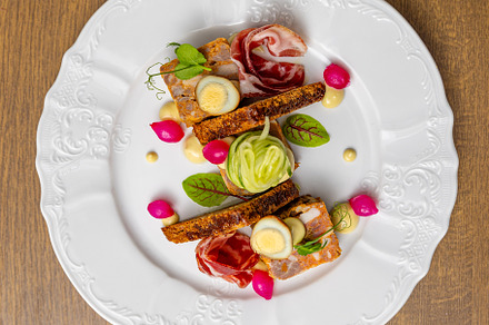 Gourmet dish, beautifully presented on a white plate, a Photo by Grafvision photography