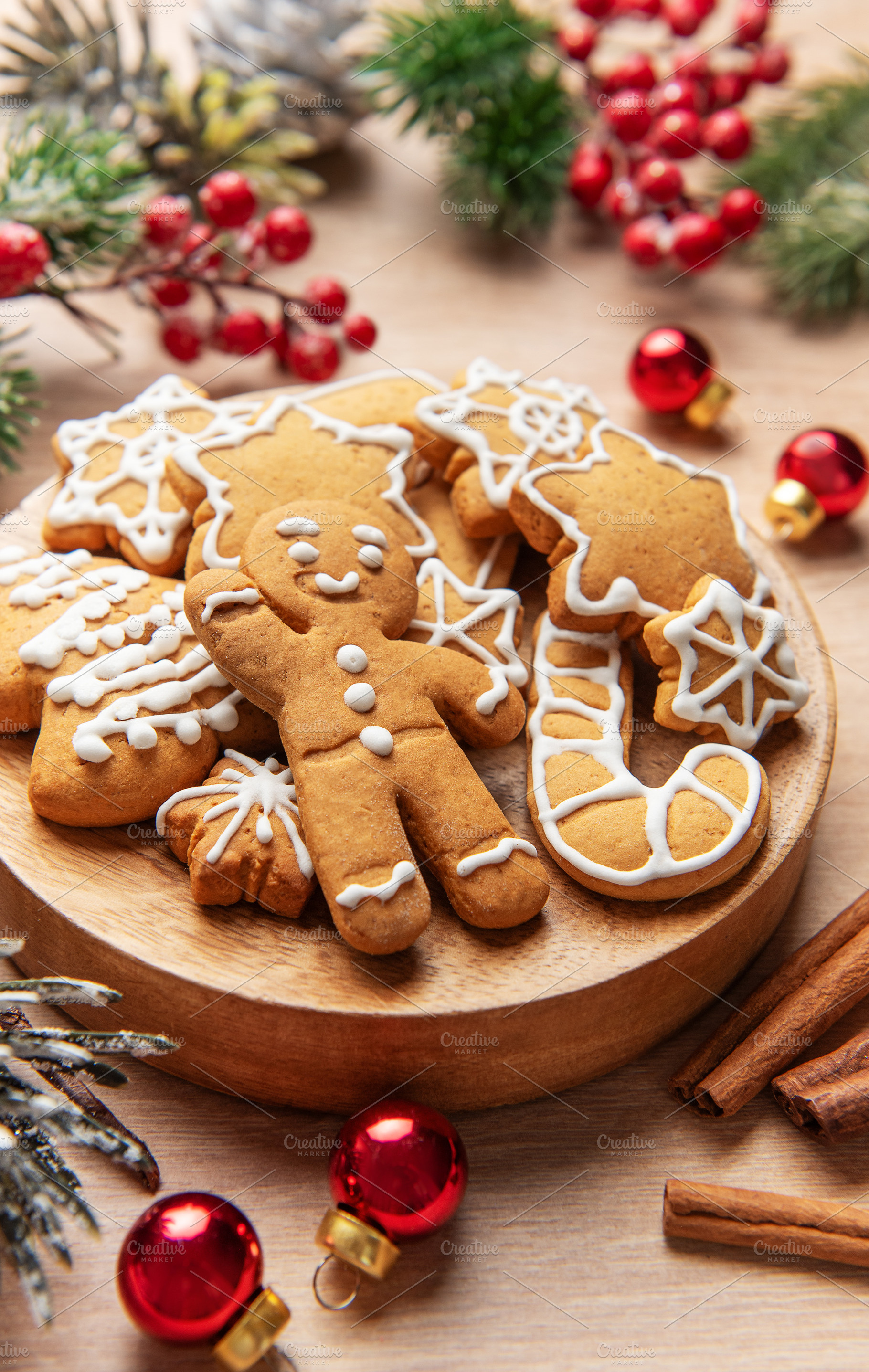 Gingerbread cookies on wooden plate with christmas decor, a Holiday Photo by Olena Rudo