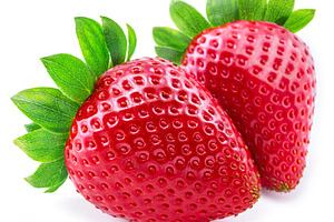 Two ripe strawberries isolated on white background., a Food & Drink Photo by Volff