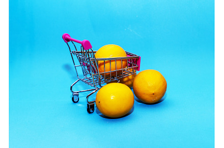 Oranges in an iron grocery cart on a, a Food & Drink Photo by shahin.mammadov