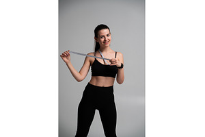 Young woman smiling, wearing black, a Sports & Recreation Photo by volodymyrshtun13795