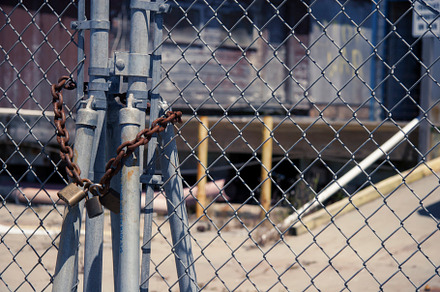 Padlock on chain link photo featuring chain link, fence, and padlock