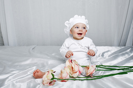 Little girl and flowers containing lifestyle, people, and child, a Person Photo by Elena Vagengeim