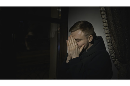 Young man sits tired and looks out, a Person Photo by Media Whale Stock