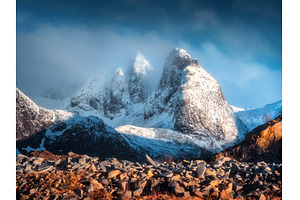 Snow-capped mountain peaks in low, a Nature Photo by den-belitsky