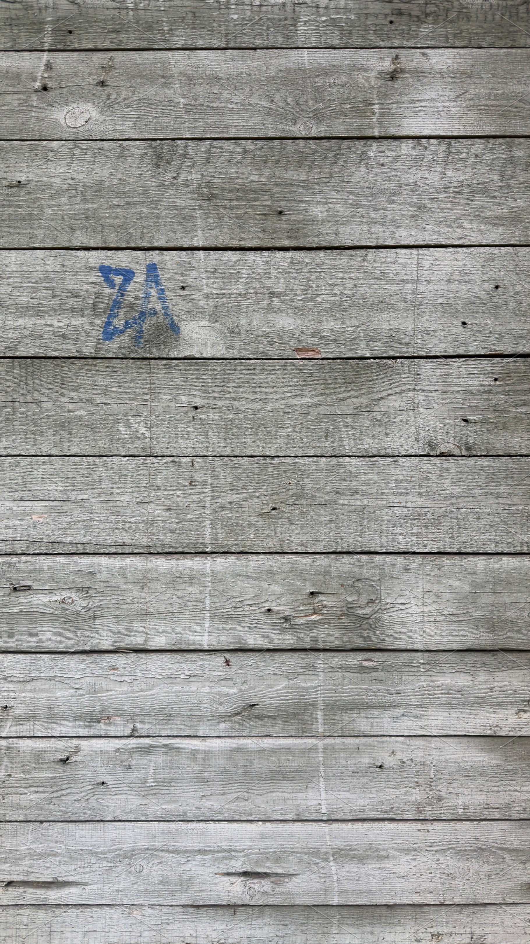 A close-up view of weathered wooden planks with a gray finish, featuring subtle, a Nature Photo by Textures & Backgrounds