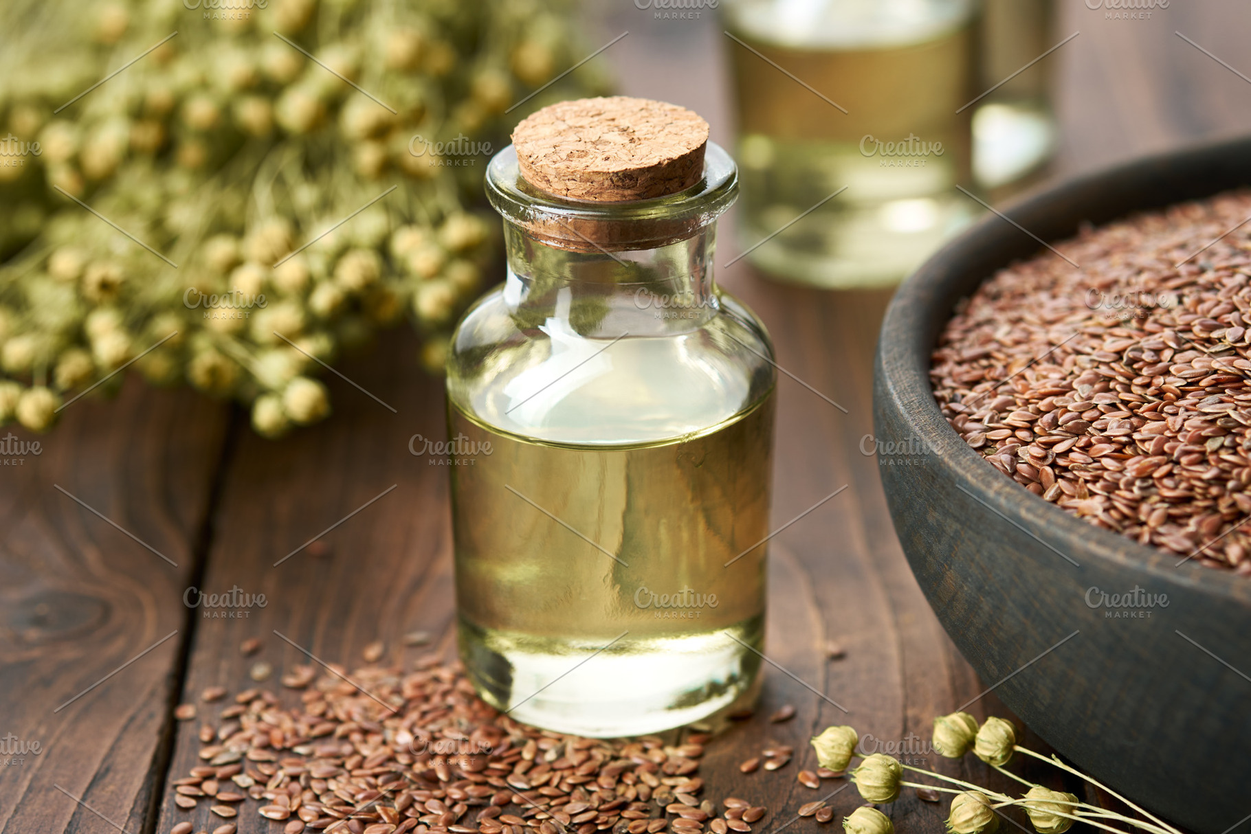 Linseed oil bottle and flax seeds, a Food & Drink Photo by chamillewhite