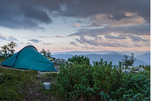 Camping tent on a mountain summit, a Nature Photo by Stockphoto by vzwer