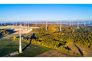 Aerial view of a wind farm in stock photo containing wind and turbine, an Industrial Photo by Leonid Andronov