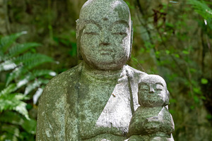 Jizo Bosatsu statue holding baby at Mitaki-Dera in Hiroshima, an Arts & Entertainment Photo by GoodGoods