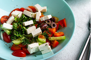 Greek salad with vegetables, olives, a Food & Drink Photo by Yulia Furman