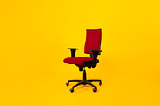 Empty Adjustable Ergonomic Office Chair With Armrests Over Yellow Background, a Photo by Prostock-Studio (Thumbnail 2 of 2)