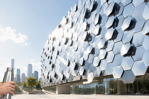 Modern hexagonal building reflecting, a Photo by Dvoevnore photos