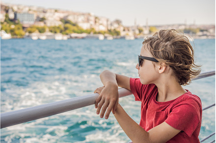 Happy boy enjoying the sea from, an Architecture Photo by Elizaveta Galitskaya