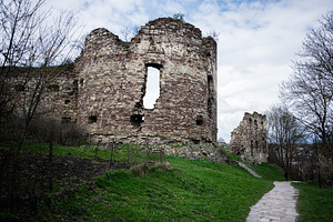 Historic ruined fortress in Buchach surrounded by natural greenery and stone pa, a Photo by AS photostudio