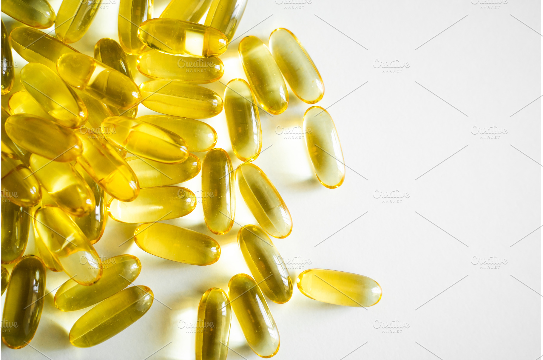 Close-up of scattered yellow fish, a Health & Medical Photo by volodymyrshtun13795