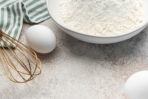 Baking ingredients on counter preparing dough, a Food & Drink Photo by Olena Rudo