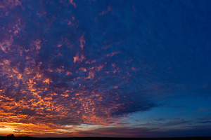 Dramatic blue and orange sunset clou, a Nature Photo by Elena Vagengeim