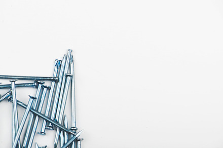 Nails on white background copy space isolated featuring nail, nails, and metal, an Industrial Photo by José Luis Agudo