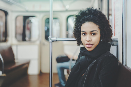 Biracial girl in metro car, a Person Photo by SkyNext