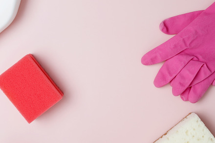 Household cleaning and hygiene concept. Pink cleaning supplies including rubber, a Photo by matucha