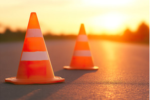 Orange traffic safety cones on road, an Industrial Photo by Lermont51