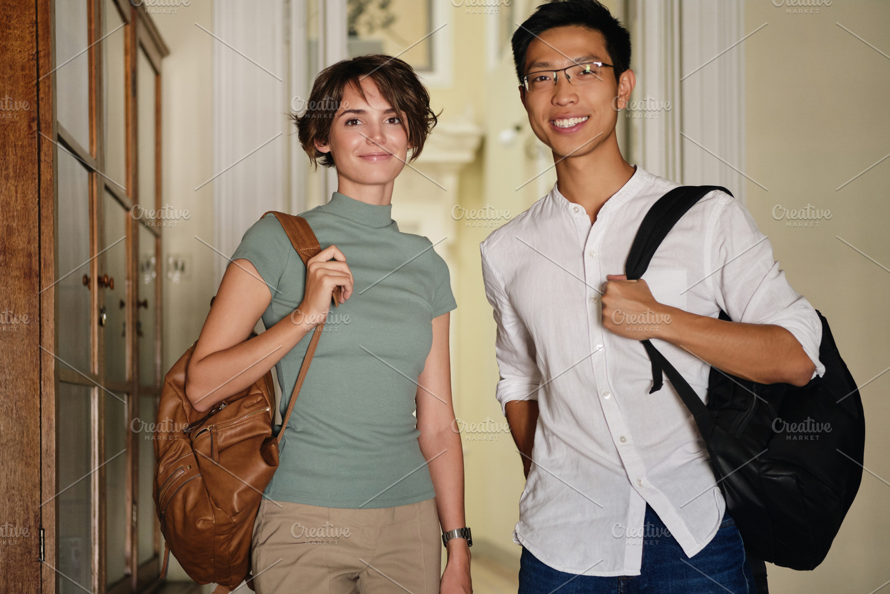 Two young attractive international s stock photo containing happy and positive, a Person Photo by Garetsworkshop
