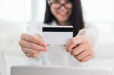 Young Asian woman use credit card for online shopping with lapto, a Business Photo by Ministocker