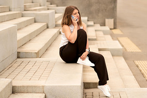 Young woman checking phone, a Person Photo by Elena Vagengeim