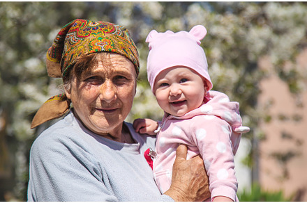 Grandmother holds her granddaughter, a Person Photo by yanadjana