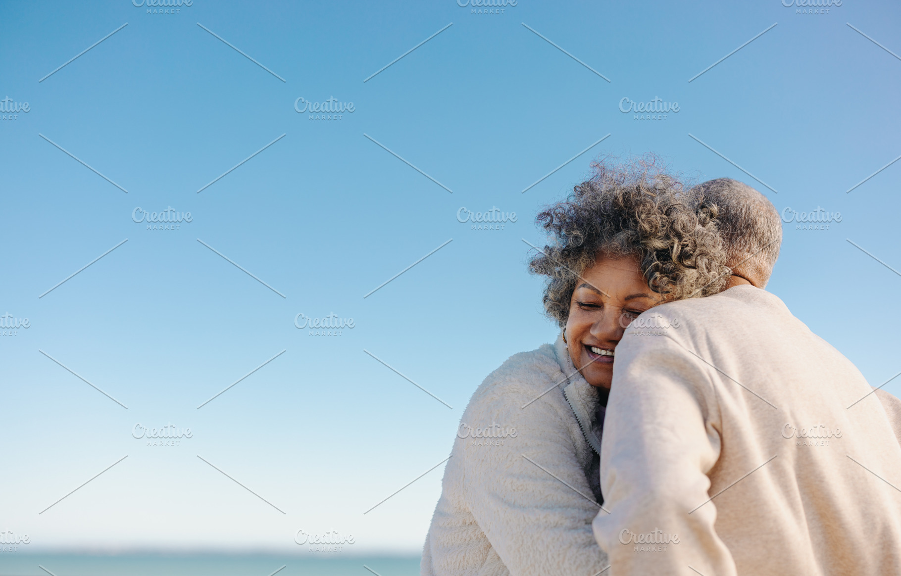 Affectionate senior woman smiling while leaning on her husband, a Person Photo by Jacob Lund