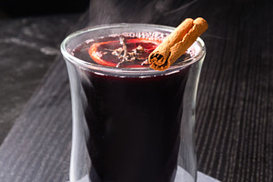 Hot Mulled Wine with Orange Slice and Cinnamon Stick in Glass on, a Photo by MDBildes