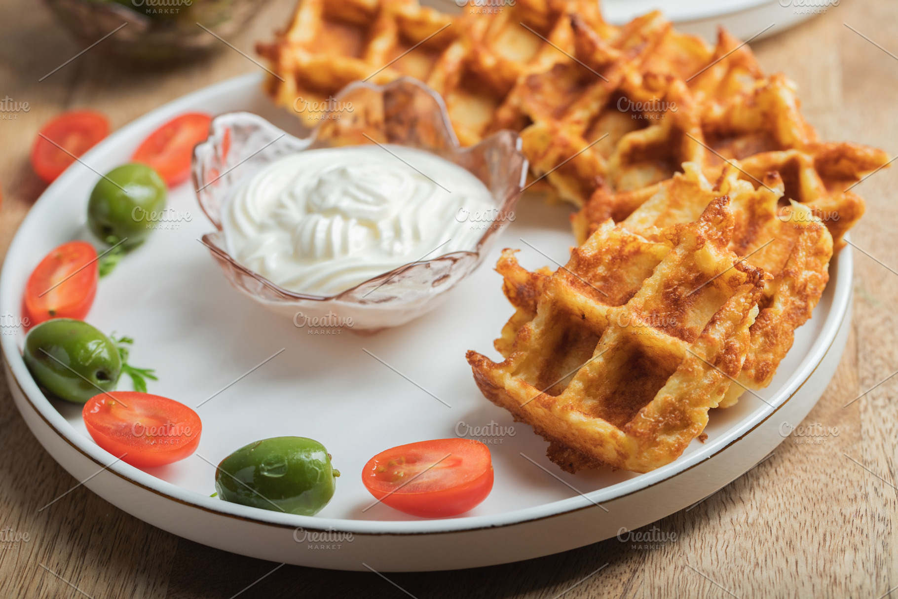 Top view of Homemade Potato Waffles, ricotta cheese and mayonese sauce. Served, a Food & Drink Photo by Budarinphoto