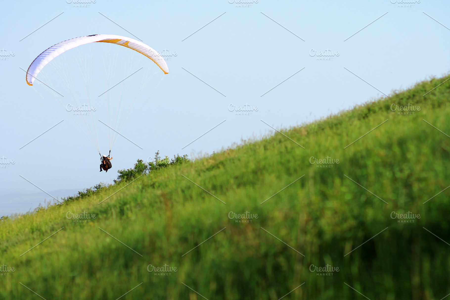 Paraglider containing paraglider, meadow, and grass, a Sports & Recreation Photo by VIBE Collective