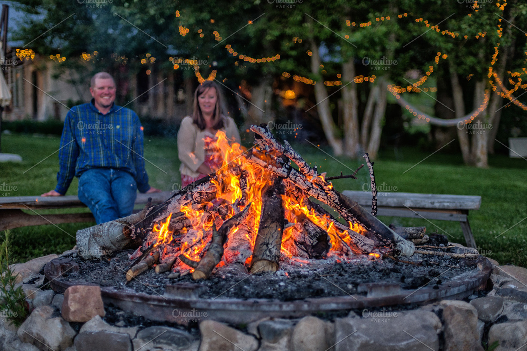 Couple Enjoying Backyard Bonfire, a Person Photo by The Native Lens