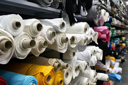 Fabric warehouse with many containing fabric, warehouse, and shelf