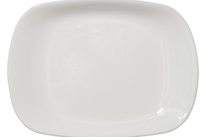 Empty white oval ceramic plate on isolated background, top view, a Food & Drink Photo by ndanko