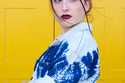 pensive woman posing on yellow backg, a Person Photo by Harry Rendón